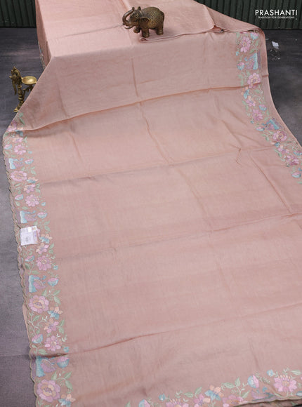 Pure tussar silk saree pastel peach with plain body and floral design embroidery border
