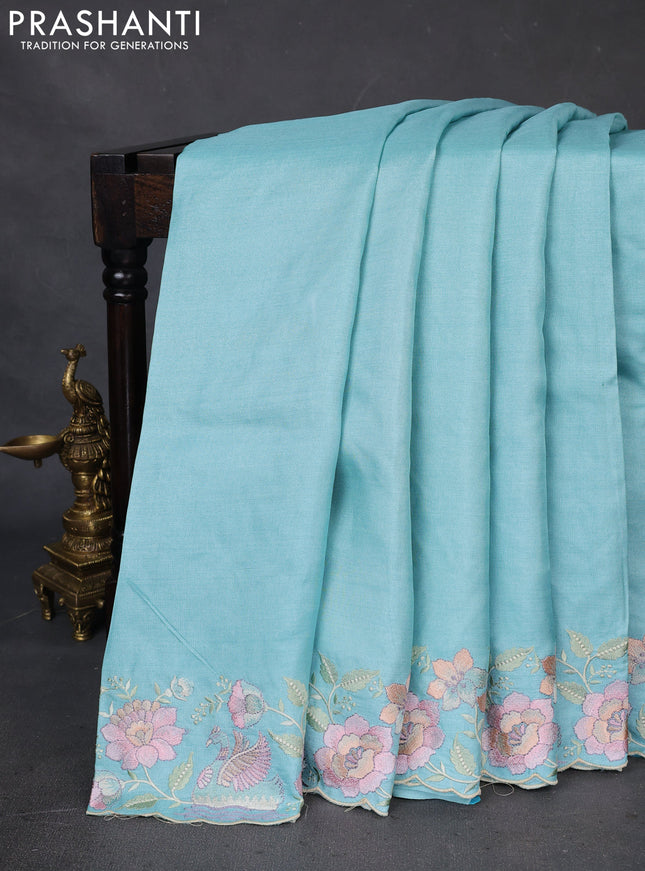 Pure tussar silk saree light blue with plain body and floral design embroidery border