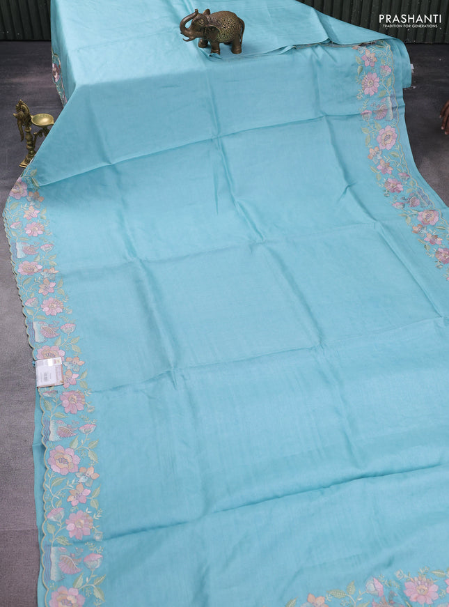 Pure tussar silk saree light blue with plain body and floral design embroidery border