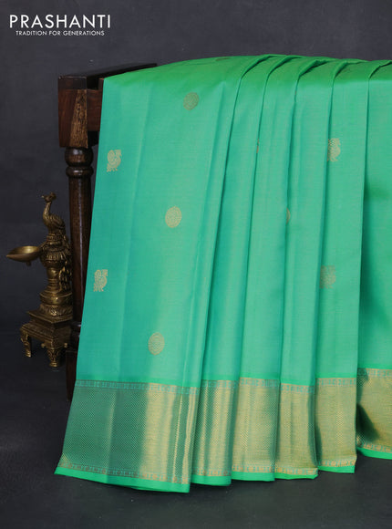 Pure kanchipuram silk saree teal green and dual shade of pinkish orange with allover vairaosi pattern & zari buttas and zari woven border