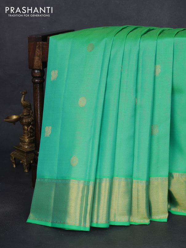 Pure kanchipuram silk saree teal green and dual shade of pinkish orange with allover vairaosi pattern & zari buttas and zari woven border