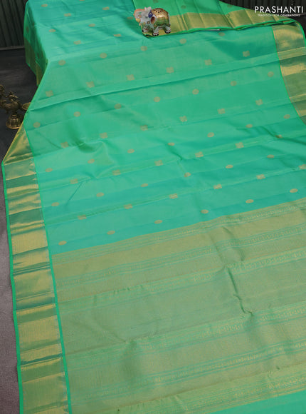 Pure kanchipuram silk saree teal green and dual shade of pinkish orange with allover vairaosi pattern & zari buttas and zari woven border