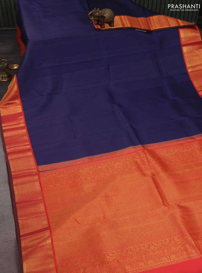 Pure kanchipuram silk saree blue and dual shade of pinkish orange with plain body and zari woven korvai border