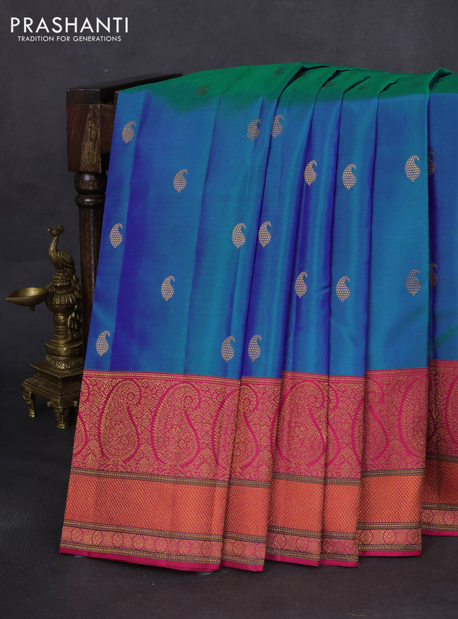 Pure kanchipuram silk saree dual shade of teal blue and pink with paisley zari woven buttas and rich paisley design zari woven border