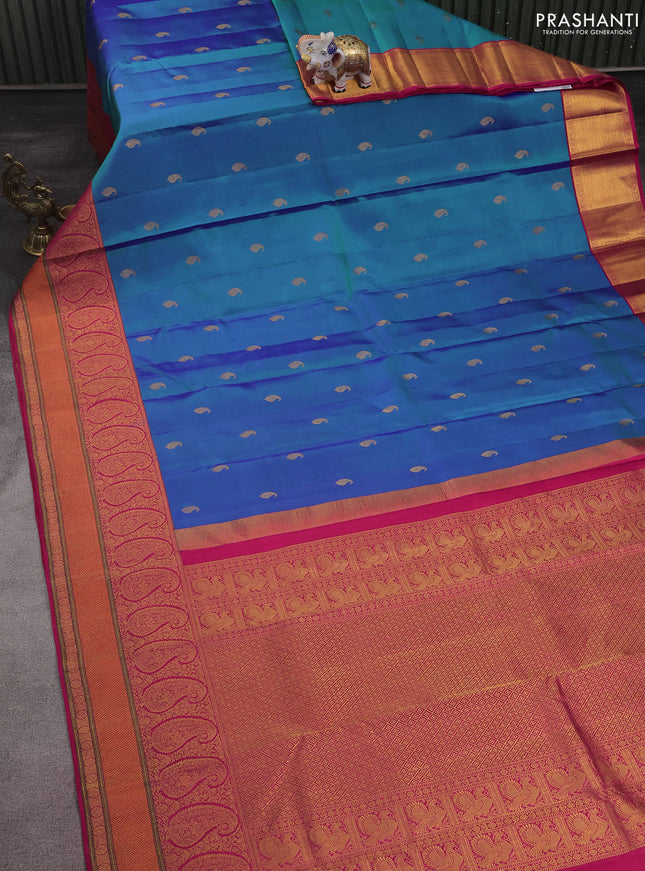 Pure kanchipuram silk saree dual shade of teal blue and pink with paisley zari woven buttas and rich paisley design zari woven border