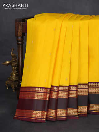 Pure kanchipuram silk saree yellow and wine shade with zari woven buttas and rettapet zari woven border
