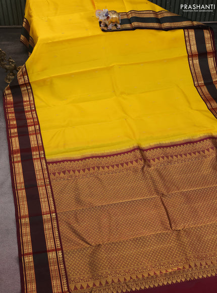 Pure kanchipuram silk saree yellow and wine shade with zari woven buttas and rettapet zari woven border