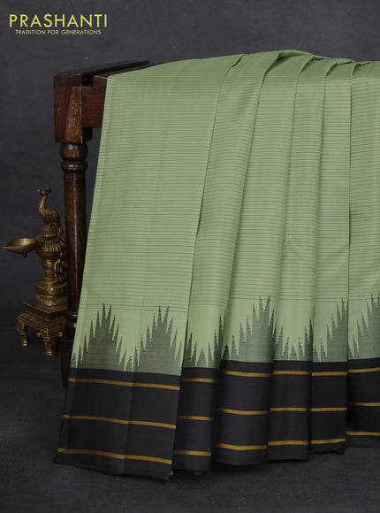 Pure kanchipuram silk saree pastel green and black with allover stripes pattern and temple design simple border
