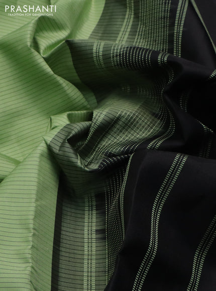 Pure kanchipuram silk saree pastel green and black with allover stripes pattern and temple design simple border