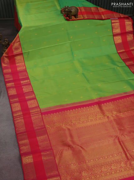 Pure kanchipuram silk saree light green and dual shade of pinkish orange with zari woven buttas and rettapet zari woven border