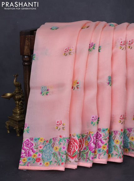 Pure organza silk saree peach shade with embroidery work buttas and floral design embroidery border
