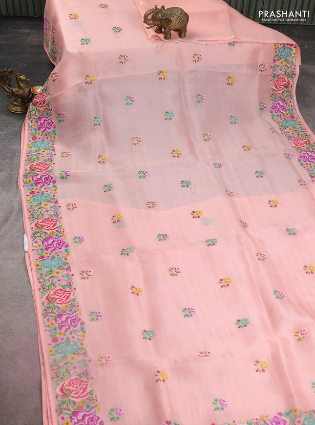 Pure organza silk saree peach shade with embroidery work buttas and floral design embroidery border