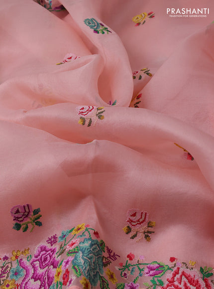 Pure organza silk saree peach shade with embroidery work buttas and floral design embroidery border