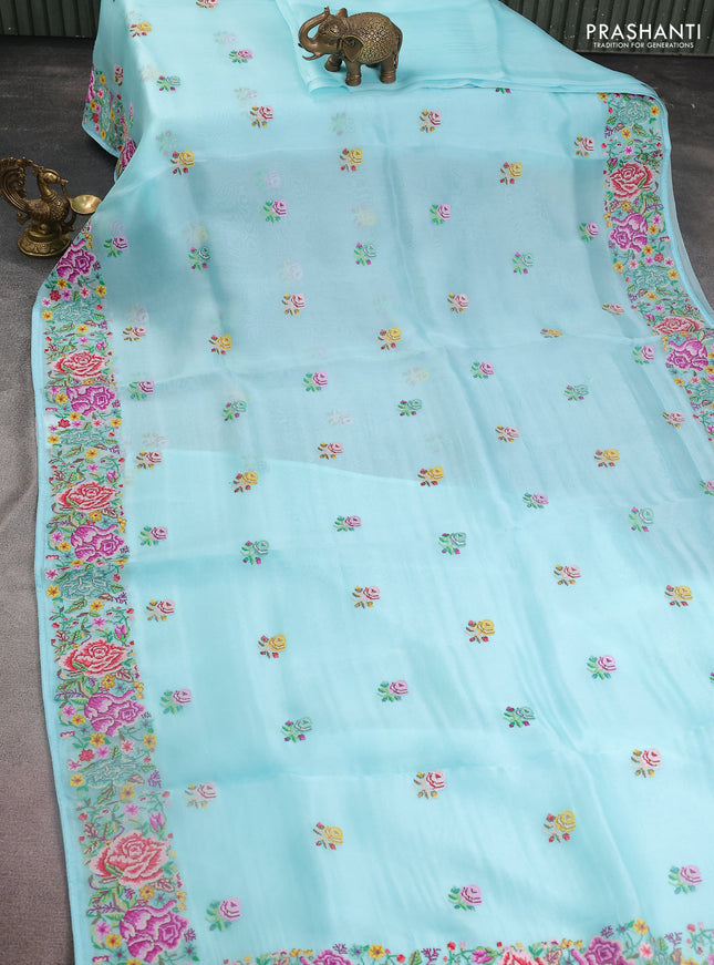 Pure organza silk saree light blue with embroidery work buttas and floral design embroidery border