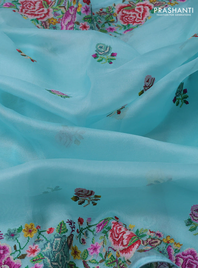 Pure organza silk saree light blue with embroidery work buttas and floral design embroidery border