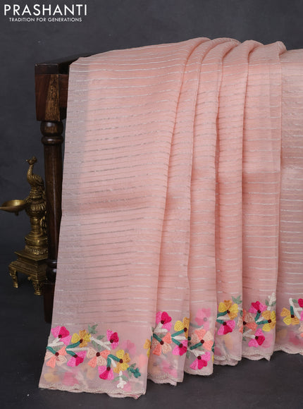 Pure organza silk saree pastel peach with allover silver & gold zari weaves and floral design embroidery border