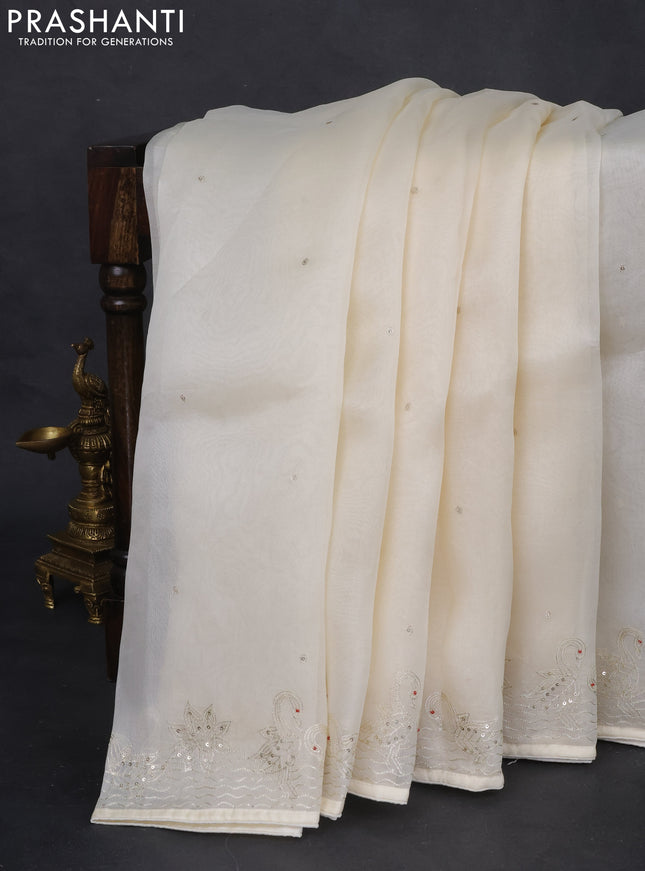 Pure organza silk saree cream with sequin work and zari woven border