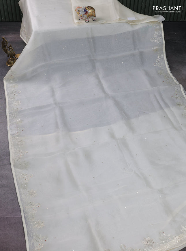 Pure organza silk saree cream with sequin work and zari woven border