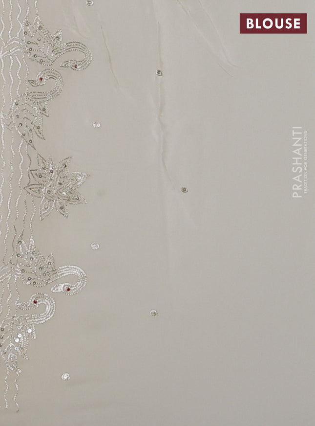 Pure organza silk saree cream with sequin work and zari woven border