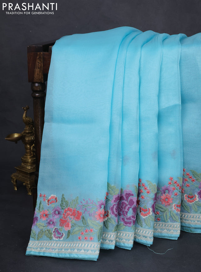 Pure organza silk saree light blue with plain body and floral design embroidery work border