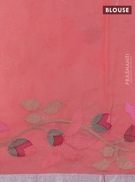 Pure organza silk saree peach shade with allover floral embroidery and silver zari woven border