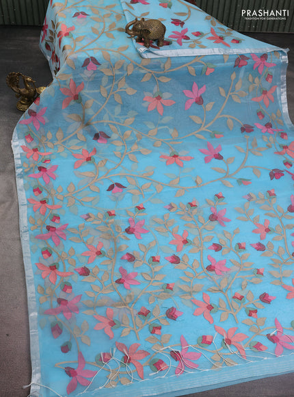 Pure organza silk saree light blue with allover floral embroidery and silver zari woven border