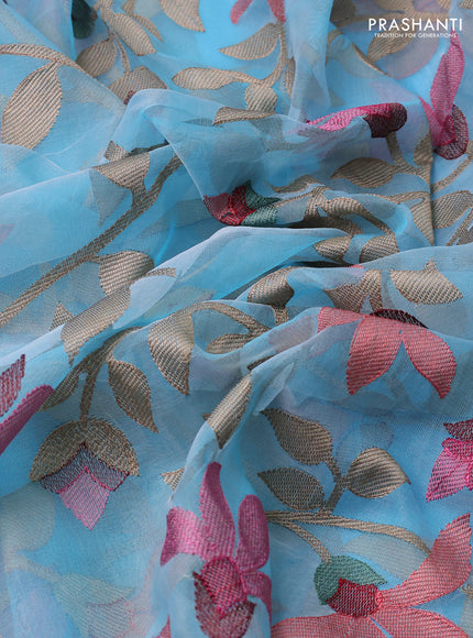 Pure organza silk saree light blue with allover floral embroidery and silver zari woven border