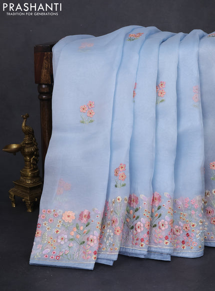 Pure organza silk saree pastel blue with allover floral embroidery and embroidery border
