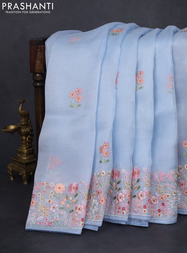 Pure organza silk saree pastel blue with allover floral embroidery and embroidery border
