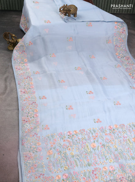 Pure organza silk saree pastel blue with allover floral embroidery and embroidery border