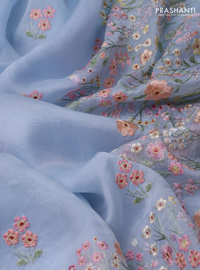 Pure organza silk saree pastel blue with allover floral embroidery and embroidery border