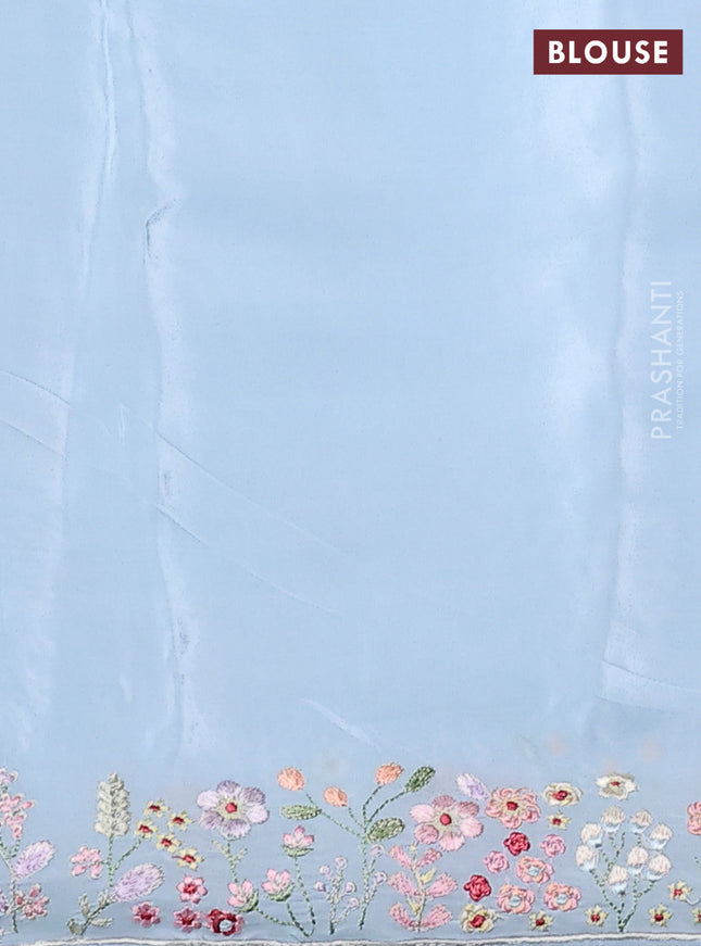 Pure organza silk saree pastel blue with allover floral embroidery and embroidery border