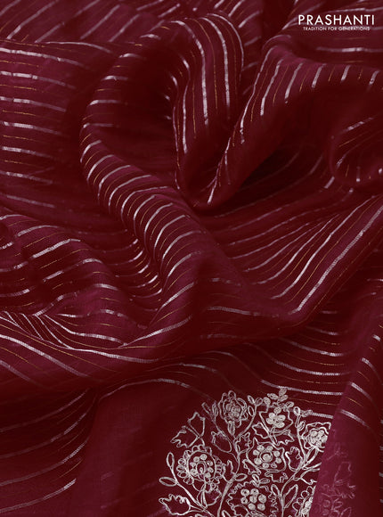 Pure organza silk saree rust shade with zari stripes pattern and embroided butta border