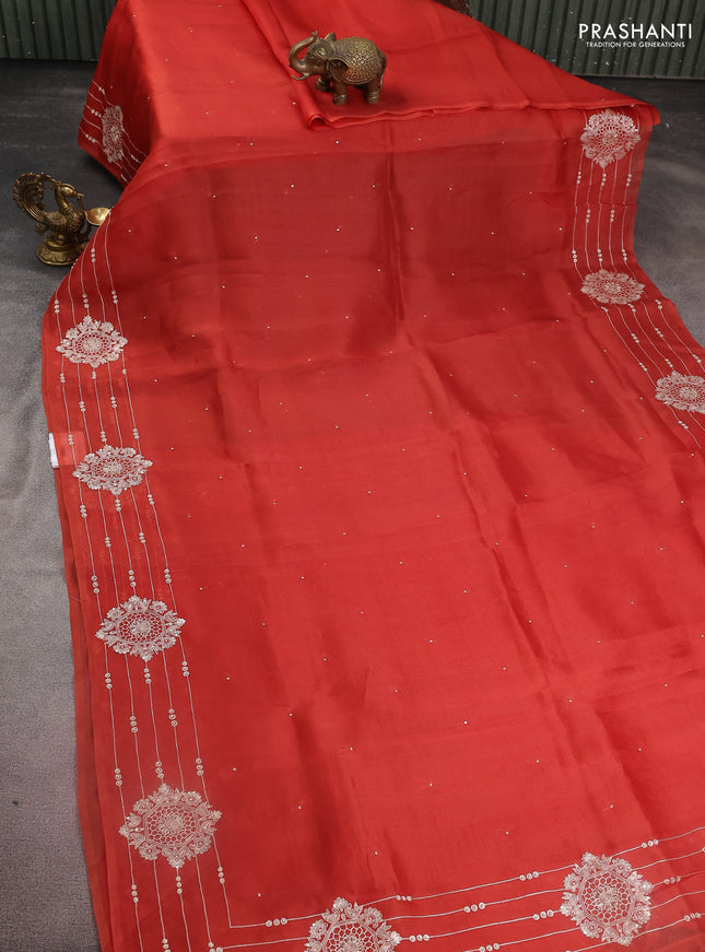 Pure organza silk saree rust shade with zari buttas and embroidery border