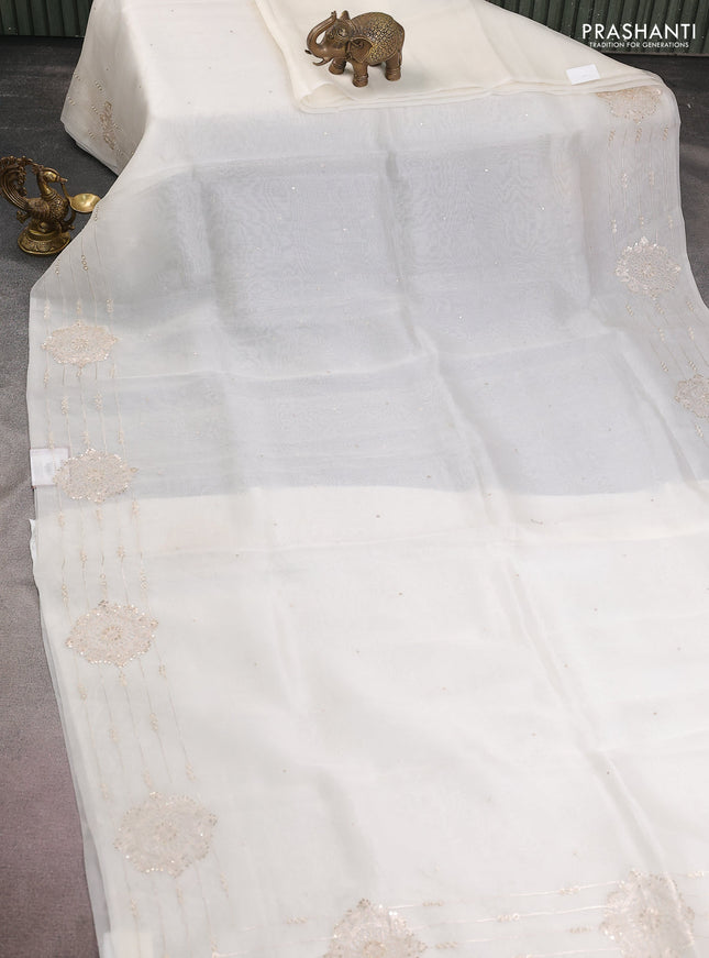 Pure organza silk saree off white with zari buttas and embroidery border