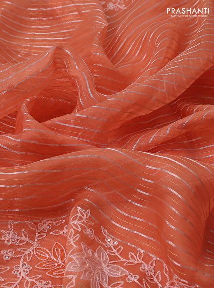 Pure organza silk saree orange with zari stripes pattern and embroidery border