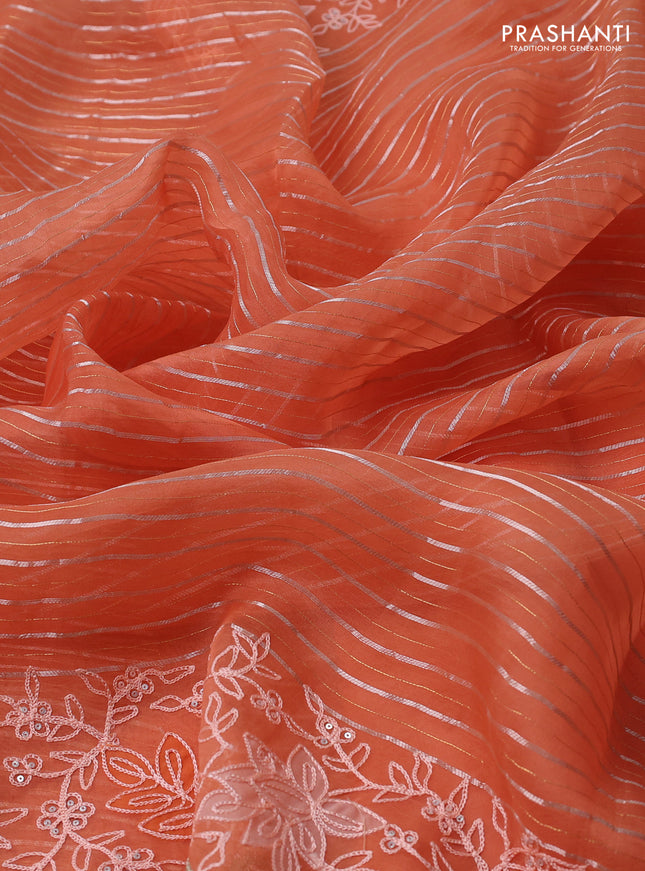 Pure organza silk saree orange with zari stripes pattern and embroidery border
