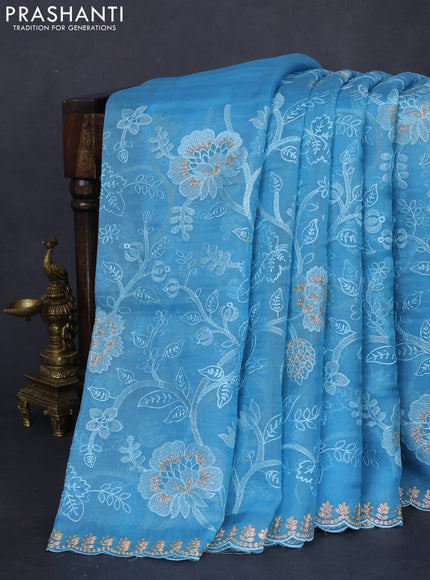Pure organza silk saree light blue with allover floral embroidery and zari woven border