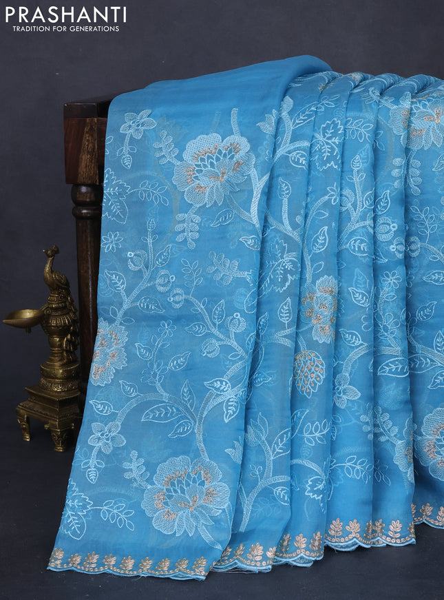Pure organza silk saree light blue with allover floral embroidery and zari woven border