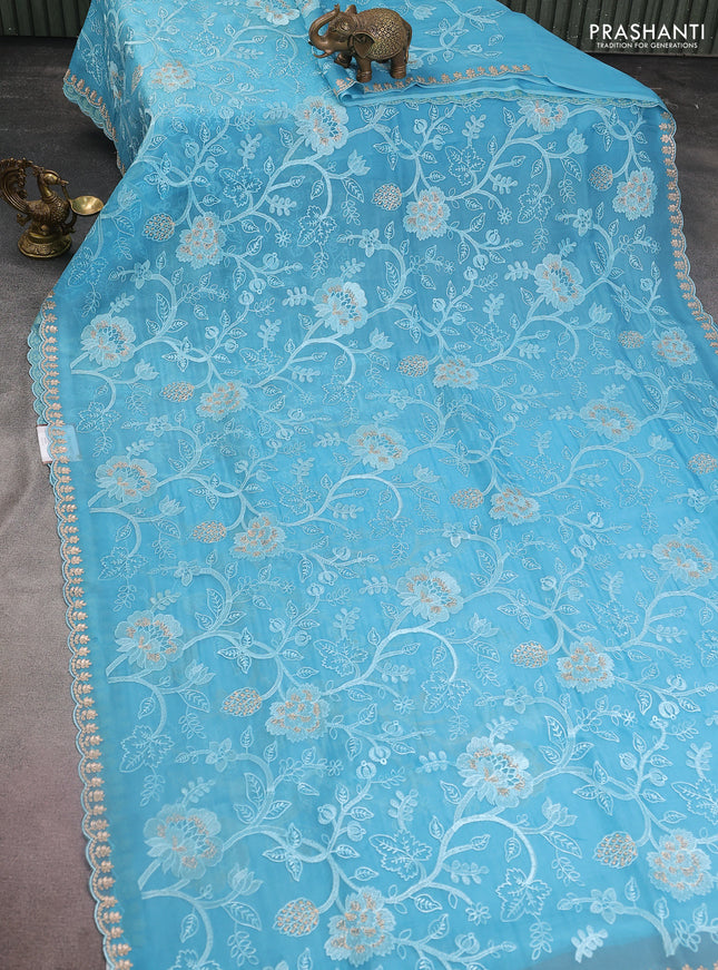 Pure organza silk saree light blue with allover floral embroidery and zari woven border