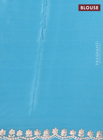 Pure organza silk saree light blue with allover floral embroidery and zari woven border