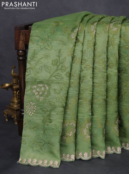 Pure organza silk saree pastel green with allover floral embroidery and zari woven border