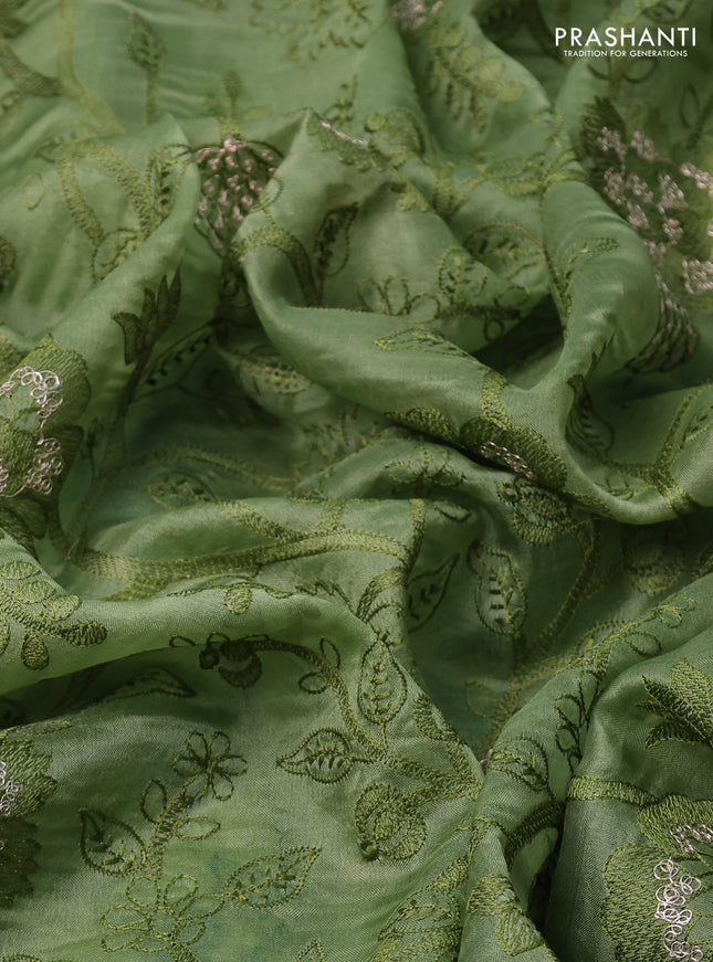 Pure organza silk saree pastel green with allover floral embroidery and zari woven border