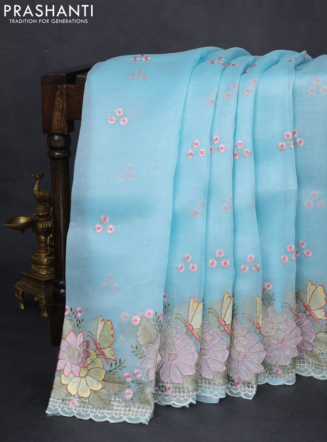 Pure organza silk saree light blue with allover floral embroidery and floral design embroidery border