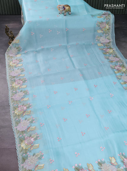 Pure organza silk saree light blue with allover floral embroidery and floral design embroidery border