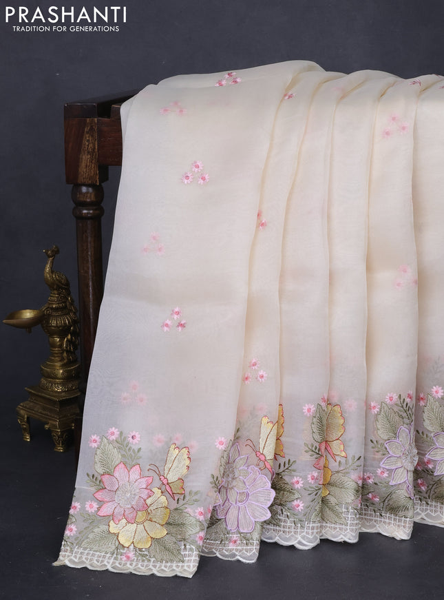 Pure organza silk saree cream with allover floral embroidery and floral design embroidery border
