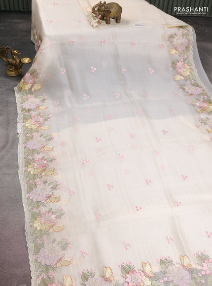 Pure organza silk saree cream with allover floral embroidery and floral design embroidery border