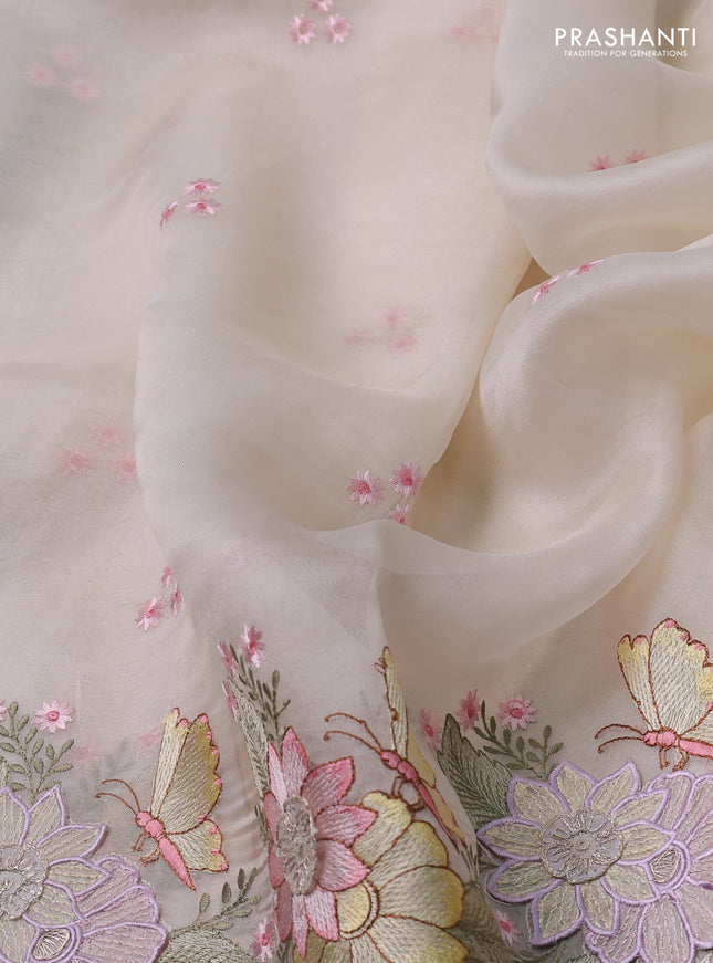 Pure organza silk saree cream with allover floral embroidery and floral design embroidery border