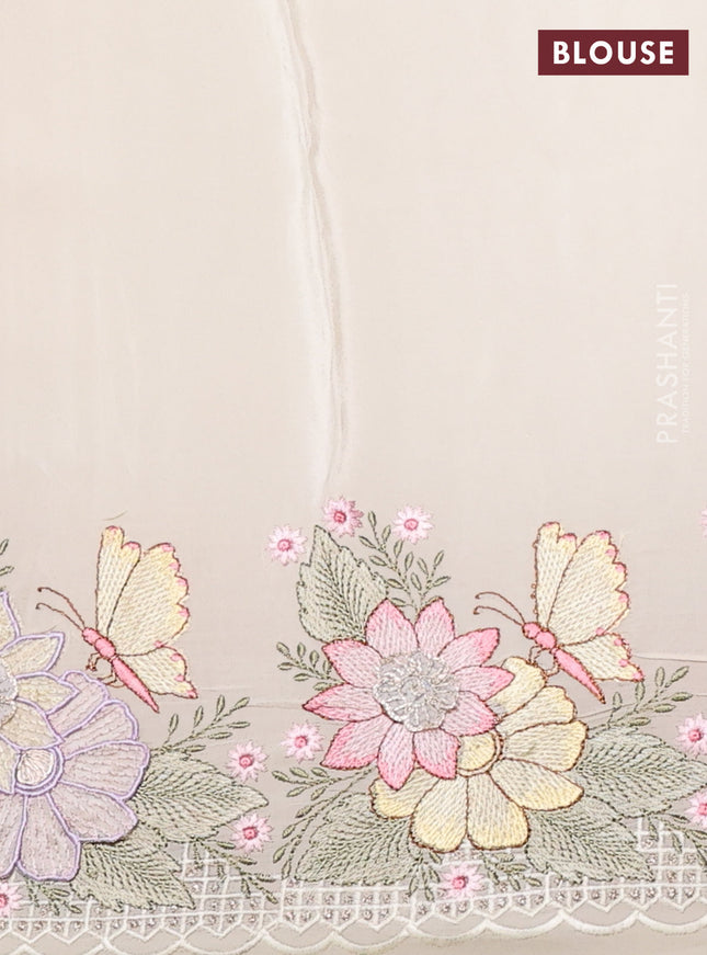 Pure organza silk saree cream with allover floral embroidery and floral design embroidery border