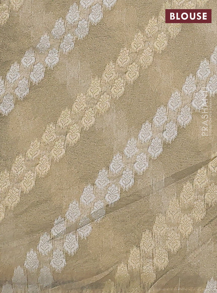 Pure organza silk saree dark green with allover floral embroidery and lace work border